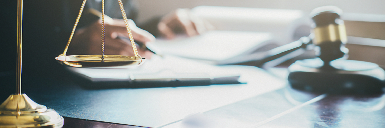 Scale and gavel on desk